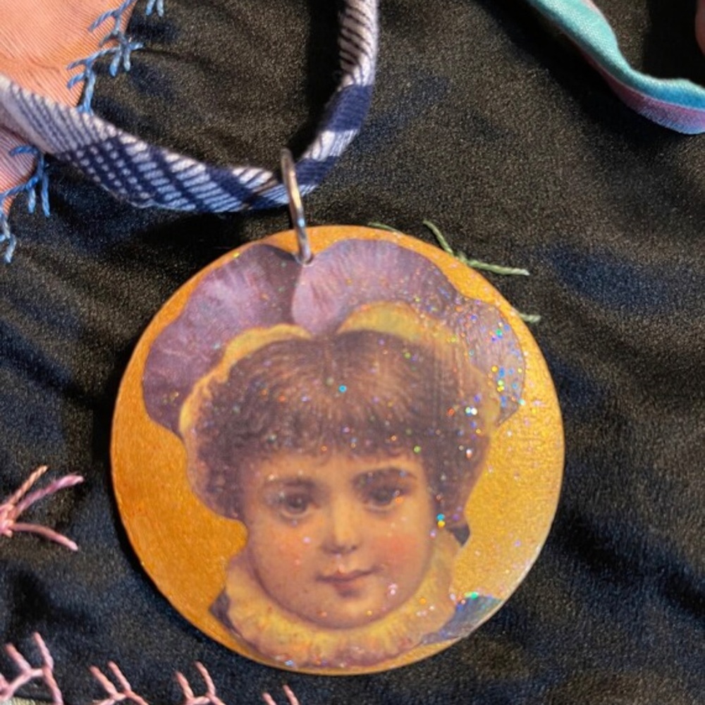 Doll face necklace